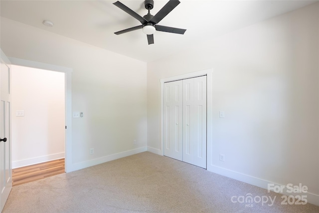 7426 Hambright Rd, Huntersville, NC 28078 - unfurnished bedroom featuring carpet, baseboards, a closet, and ceiling fan