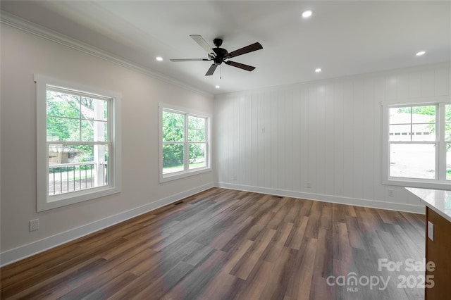 7426 Hambright Rd, Huntersville, NC 28078 - empty room with healthy amount of natural light, ornamental molding, baseboards, dark wood-type flooring, and a ceiling fan