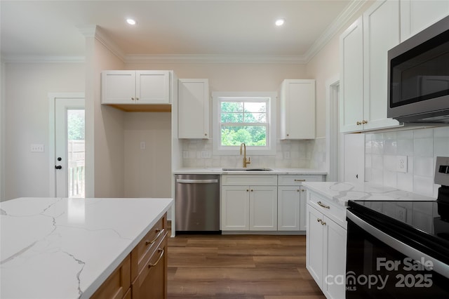 7426 Hambright Rd, Huntersville, NC 28078 - kitchen featuring stainless steel appliances, a sink, dark wood finished floors, white cabinets, and light stone countertops