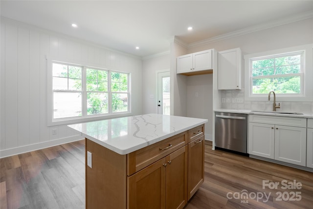 7426 Hambright Rd, Huntersville, NC 28078 - kitchen with a sink, dishwasher, crown molding, wood finished floors, and tasteful backsplash