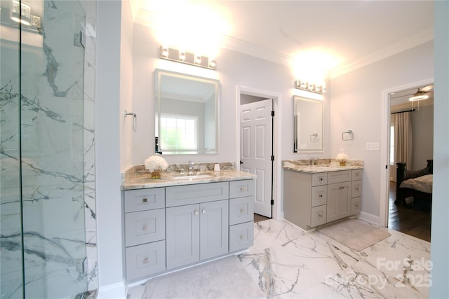 full bath with ornamental molding, marble finish flooring, two vanities, a marble finish shower, and baseboards