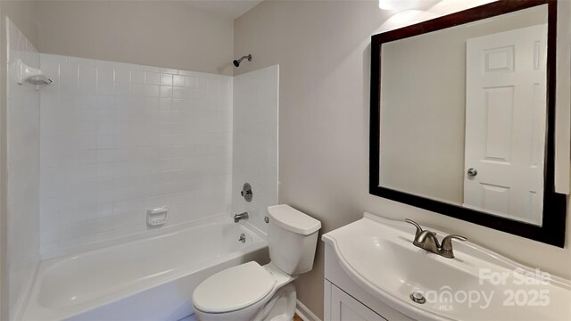 bathroom with toilet, shower / bathtub combination, and vanity