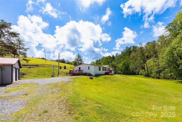 283 Grandview Dr Unit 1, Marshall, NC 28753 - view of grassy yard with a rural view and an outbuilding