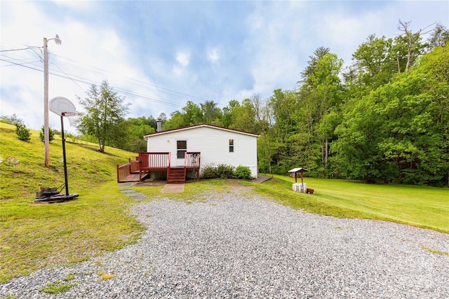 283 Grandview Dr Unit 1, Marshall, NC 28753 - view of home's exterior featuring a lawn, a wooden deck, and view of scattered trees