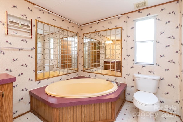 283 Grandview Dr Unit 1, Marshall, NC 28753 - full bathroom featuring toilet, tile patterned floors, a garden tub, wallpapered walls, and baseboards