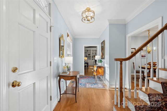 216 Saint Andrews Blvd, Campobello, SC 29322 - entrance foyer featuring light wood finished floors, a chandelier, ornamental molding, and stairway