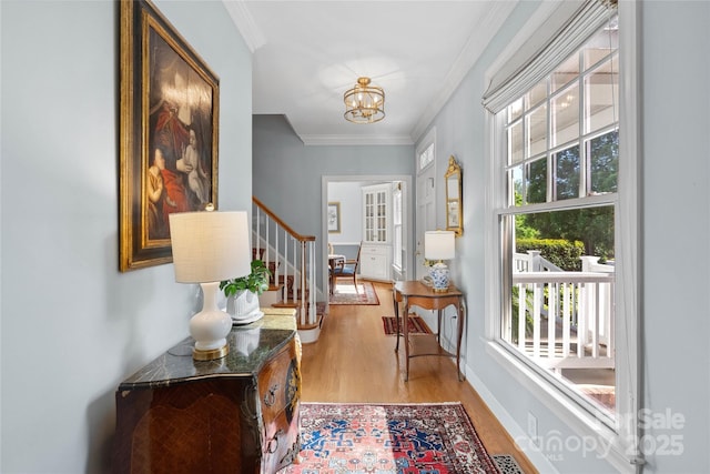 216 Saint Andrews Blvd, Campobello, SC 29322 - entryway with light wood-type flooring, healthy amount of natural light, stairway, a chandelier, and ornamental molding