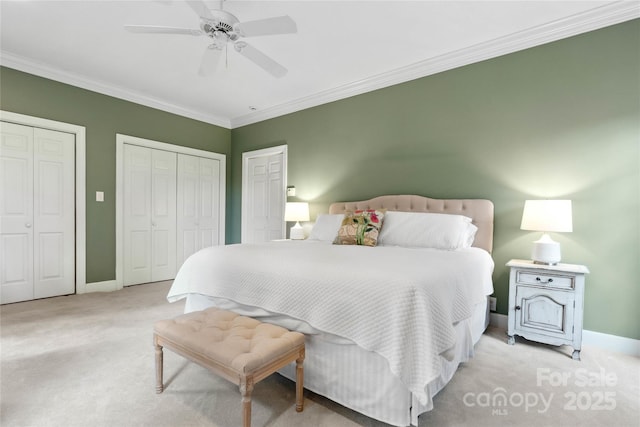 216 Saint Andrews Blvd, Campobello, SC 29322 - carpeted bedroom featuring two closets, ornamental molding, and ceiling fan