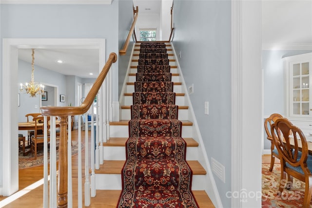 216 Saint Andrews Blvd, Campobello, SC 29322 - stairs with a chandelier, crown molding, and wood finished floors