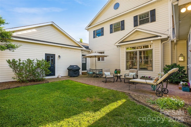 216 Saint Andrews Blvd, Campobello, SC 29322 - back of house featuring a lawn and a patio
