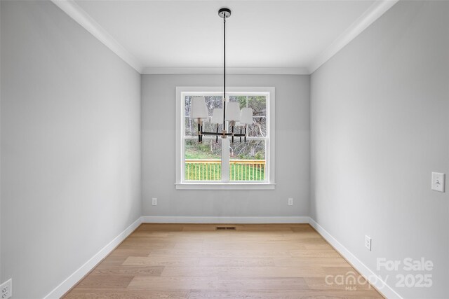 149 Beauchamp Oaks Ct, Advance, NC 27006 - unfurnished dining area featuring ornamental molding, light wood-type flooring, and baseboards
