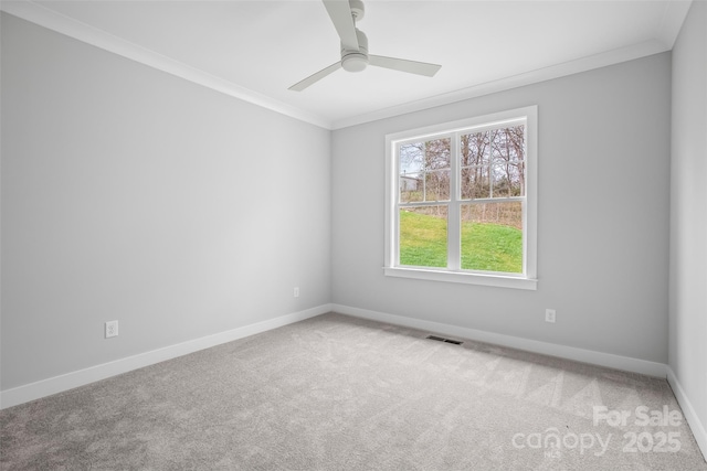 149 Beauchamp Oaks Ct, Advance, NC 27006 - spare room with carpet, baseboards, ornamental molding, and ceiling fan