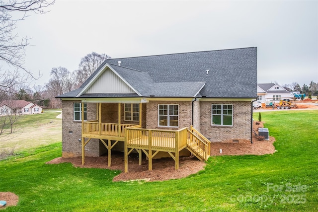 149 Beauchamp Oaks Ct, Advance, NC 27006 - back of property featuring brick siding, a lawn, a wooden deck, roof with shingles, and board and batten siding