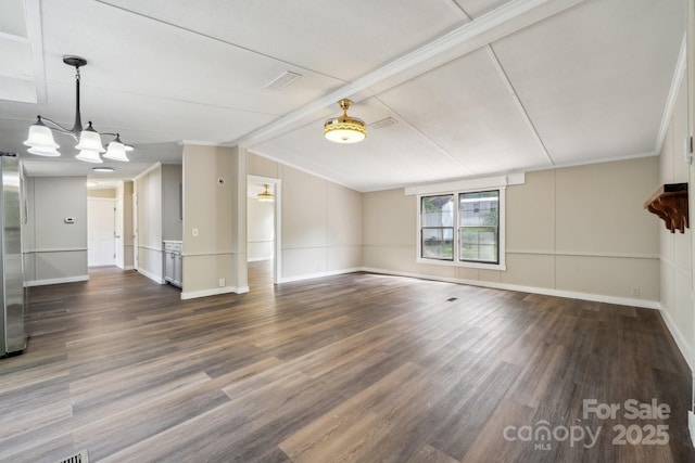 unfurnished living room featuring wood finished floors and baseboards