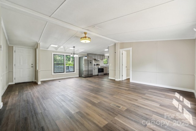 unfurnished living room with dark wood-style floors and baseboards