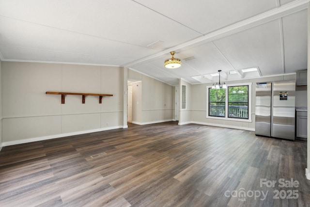 unfurnished living room featuring dark wood-type flooring and baseboards