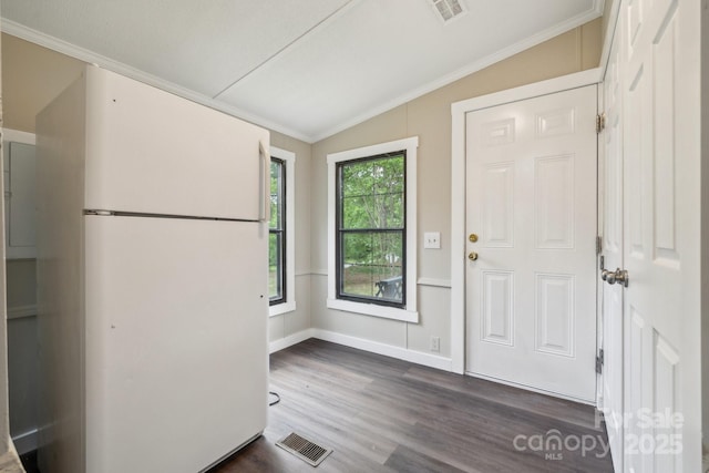foyer with vaulted ceiling, dark wood-style floors, crown molding, and baseboards