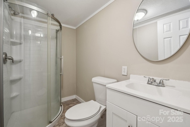 bathroom with toilet, a shower stall, vanity, and ornamental molding
