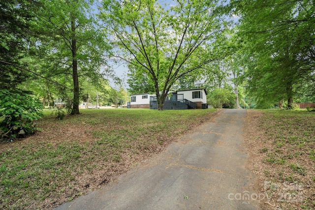 view of front of house featuring asphalt driveway
