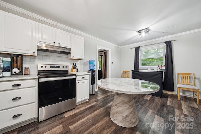 1917 Tom Sadler Rd, Charlotte, NC 28214 - kitchen with electric range, under cabinet range hood, white cabinets, dark wood finished floors, and ornamental molding