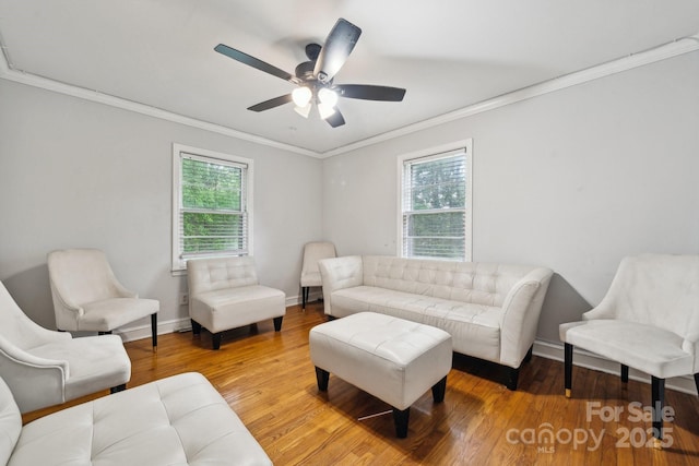 1917 Tom Sadler Rd, Charlotte, NC 28214 - living area featuring ornamental molding, wood finished floors, and a ceiling fan