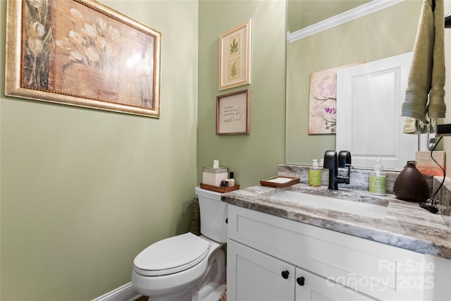 bathroom with toilet and vanity