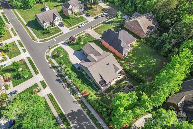 aerial view of property and surrounding area with nearby suburban area