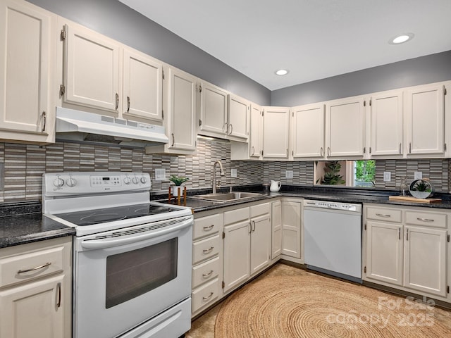 42 Hollybrook Dr, Asheville, NC 28803 - kitchen featuring white appliances, under cabinet range hood, a sink, white cabinetry, and decorative backsplash