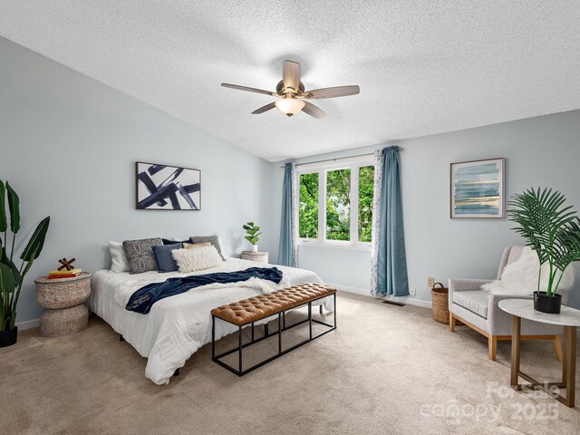 42 Hollybrook Dr, Asheville, NC 28803 - bedroom with light colored carpet, a textured ceiling, baseboards, and ceiling fan