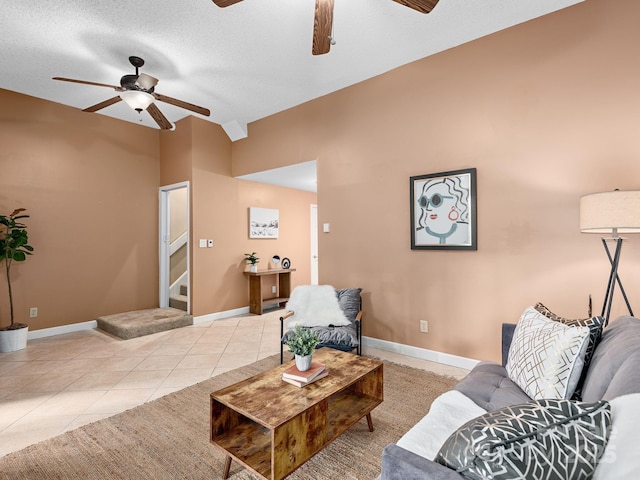42 Hollybrook Dr, Asheville, NC 28803 - living room featuring a ceiling fan, light tile patterned flooring, baseboards, and lofted ceiling