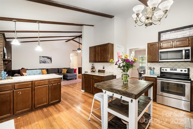 8544 Houston Ridge Rd, Charlotte, NC 28277 - kitchen featuring stainless steel appliances, decorative backsplash, beamed ceiling, light countertops, and light wood finished floors