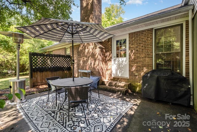 8544 Houston Ridge Rd, Charlotte, NC 28277 - view of patio featuring entry steps, area for grilling, and outdoor dining area