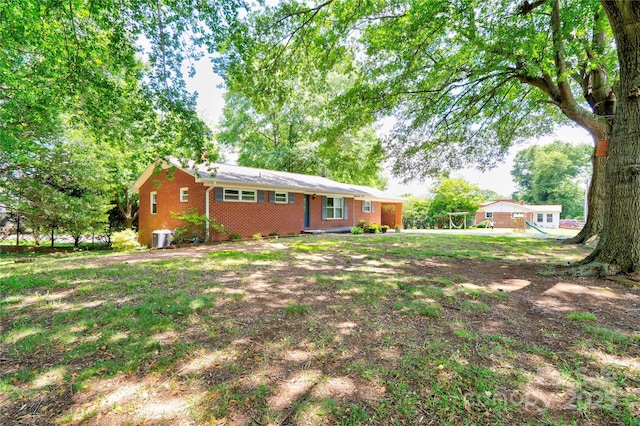 619 E Sanders Rd, Shelby, NC 28150 - rear view of house featuring brick siding and central air condition unit