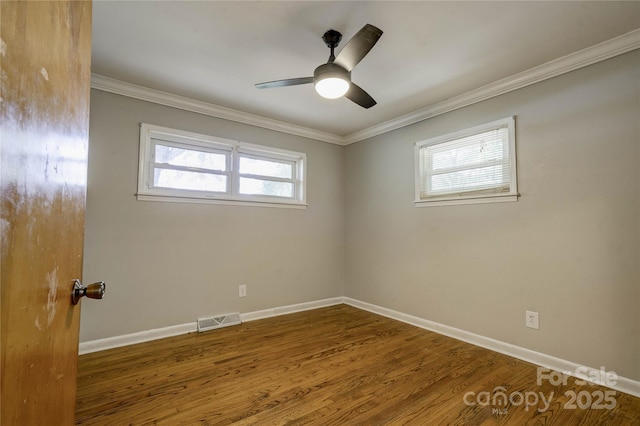 619 E Sanders Rd, Shelby, NC 28150 - spare room with baseboards, wood finished floors, ornamental molding, and a ceiling fan