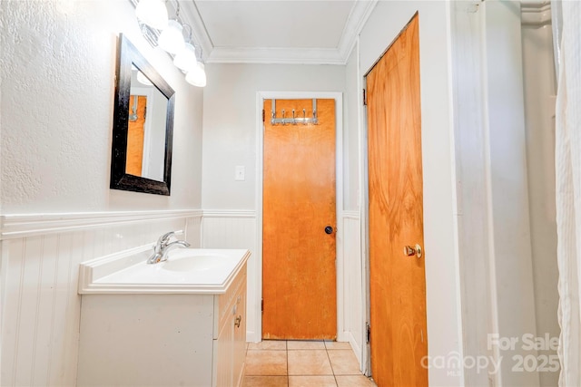 619 E Sanders Rd, Shelby, NC 28150 - bathroom with vanity, ornamental molding, tile patterned flooring, and wainscoting