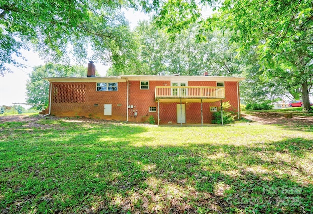 619 E Sanders Rd, Shelby, NC 28150 - rear view of property with a chimney, a yard, brick siding, and a deck