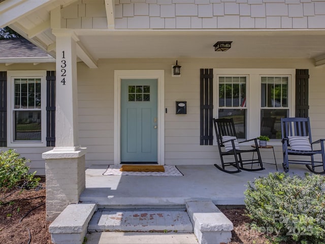property entrance featuring covered porch