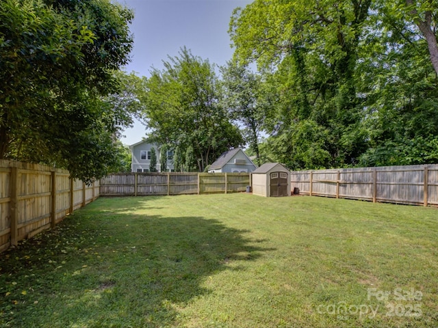 view of yard with a storage unit and an outbuilding