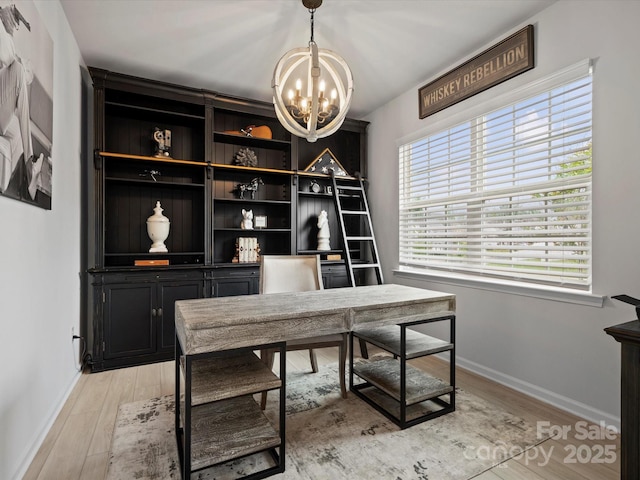 5581 Soft Shell Dr, Lancaster, SC 29720 - home office featuring a chandelier, baseboards, and light wood-style floors