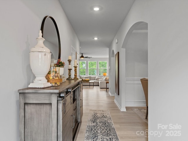 5581 Soft Shell Dr, Lancaster, SC 29720 - hallway featuring arched walkways, light wood-style floors, baseboards, and recessed lighting