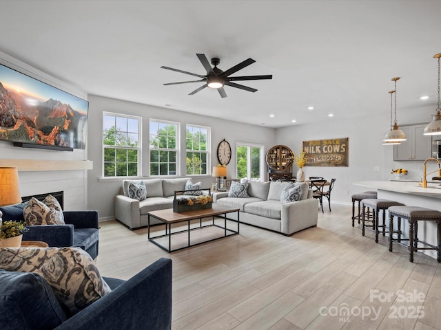 5581 Soft Shell Dr, Lancaster, SC 29720 - living area with ceiling fan, light wood finished floors, plenty of natural light, recessed lighting, and a fireplace