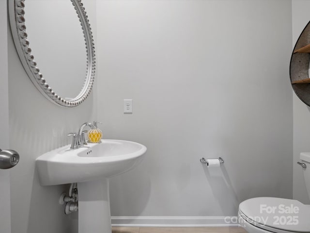 5581 Soft Shell Dr, Lancaster, SC 29720 - half bath featuring toilet and baseboards