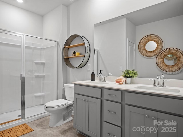 5581 Soft Shell Dr, Lancaster, SC 29720 - bathroom featuring toilet, a shower stall, double vanity, and tile patterned flooring