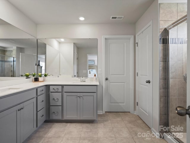 5581 Soft Shell Dr, Lancaster, SC 29720 - bathroom with a stall shower, double vanity, recessed lighting, and tile patterned floors