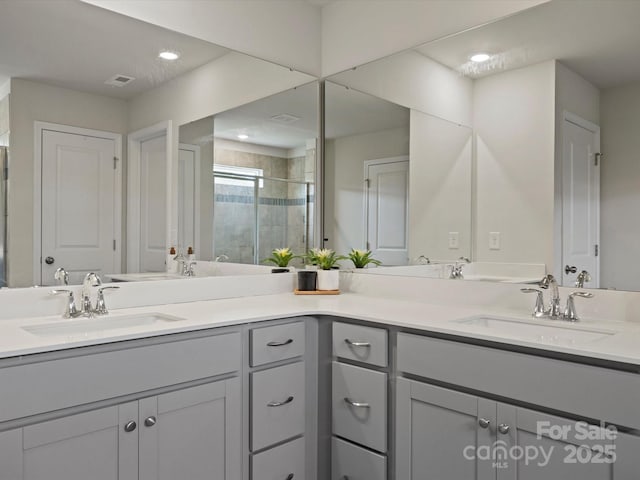 5581 Soft Shell Dr, Lancaster, SC 29720 - bathroom featuring a stall shower, double vanity, and recessed lighting