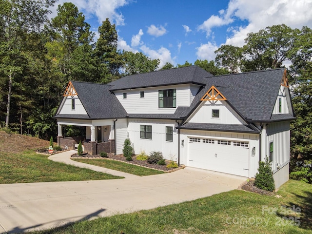 685 Knollcrest Dr NE, Concord, NC 28025 - modern inspired farmhouse featuring concrete driveway, roof with shingles, board and batten siding, and a front lawn
