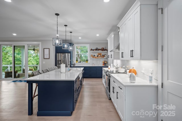 685 Knollcrest Dr NE, Concord, NC 28025 - kitchen featuring stainless steel appliances, open shelves, plenty of natural light, light countertops, and ornamental molding