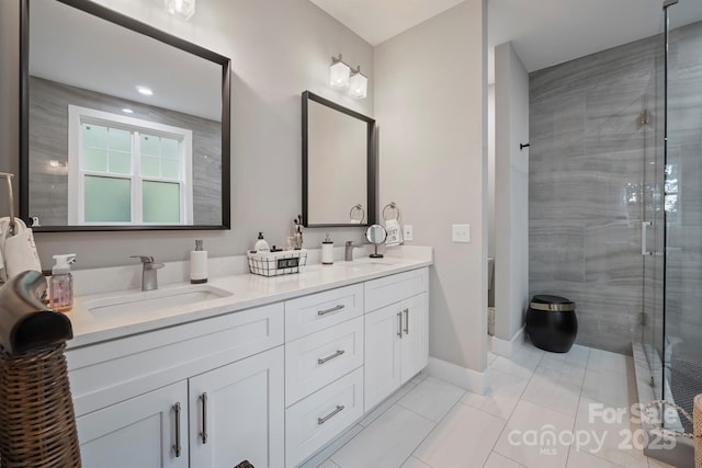 685 Knollcrest Dr NE, Concord, NC 28025 - full bathroom with double vanity, a shower stall, baseboards, and toilet