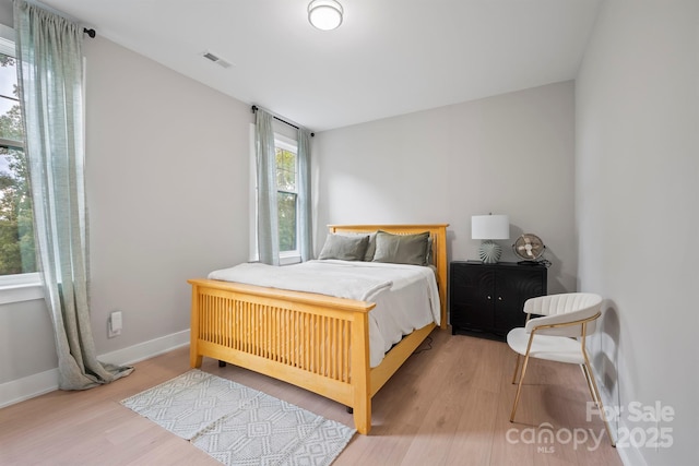 685 Knollcrest Dr NE, Concord, NC 28025 - bedroom featuring wood finished floors and baseboards