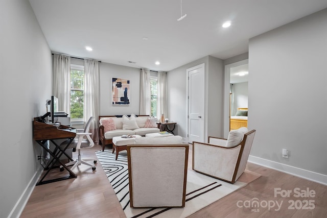 685 Knollcrest Dr NE, Concord, NC 28025 - living room featuring light wood-style floors, recessed lighting, a desk, and baseboards
